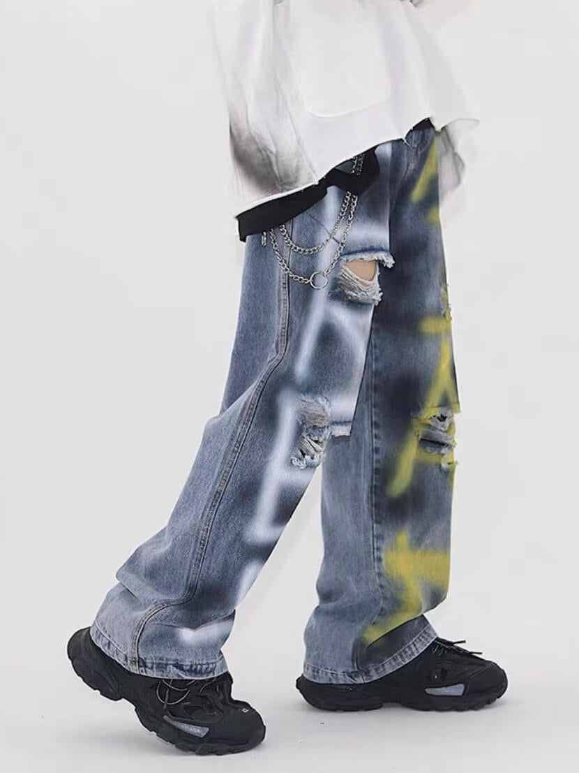 destroyed jeans with graffiti on legs, blue