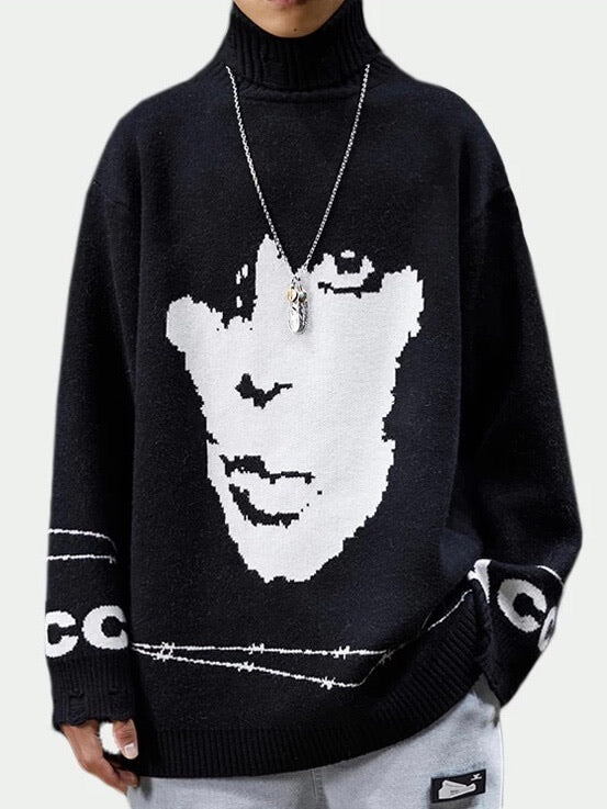 black knitted sweater with a white face on the front and a barbed wire