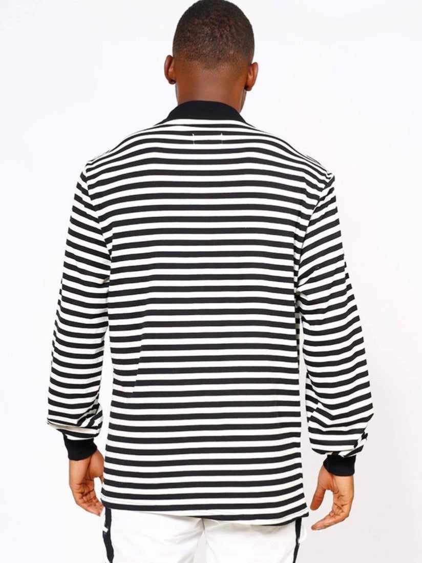 back view of our black and white striped sweater with black wrists and collar