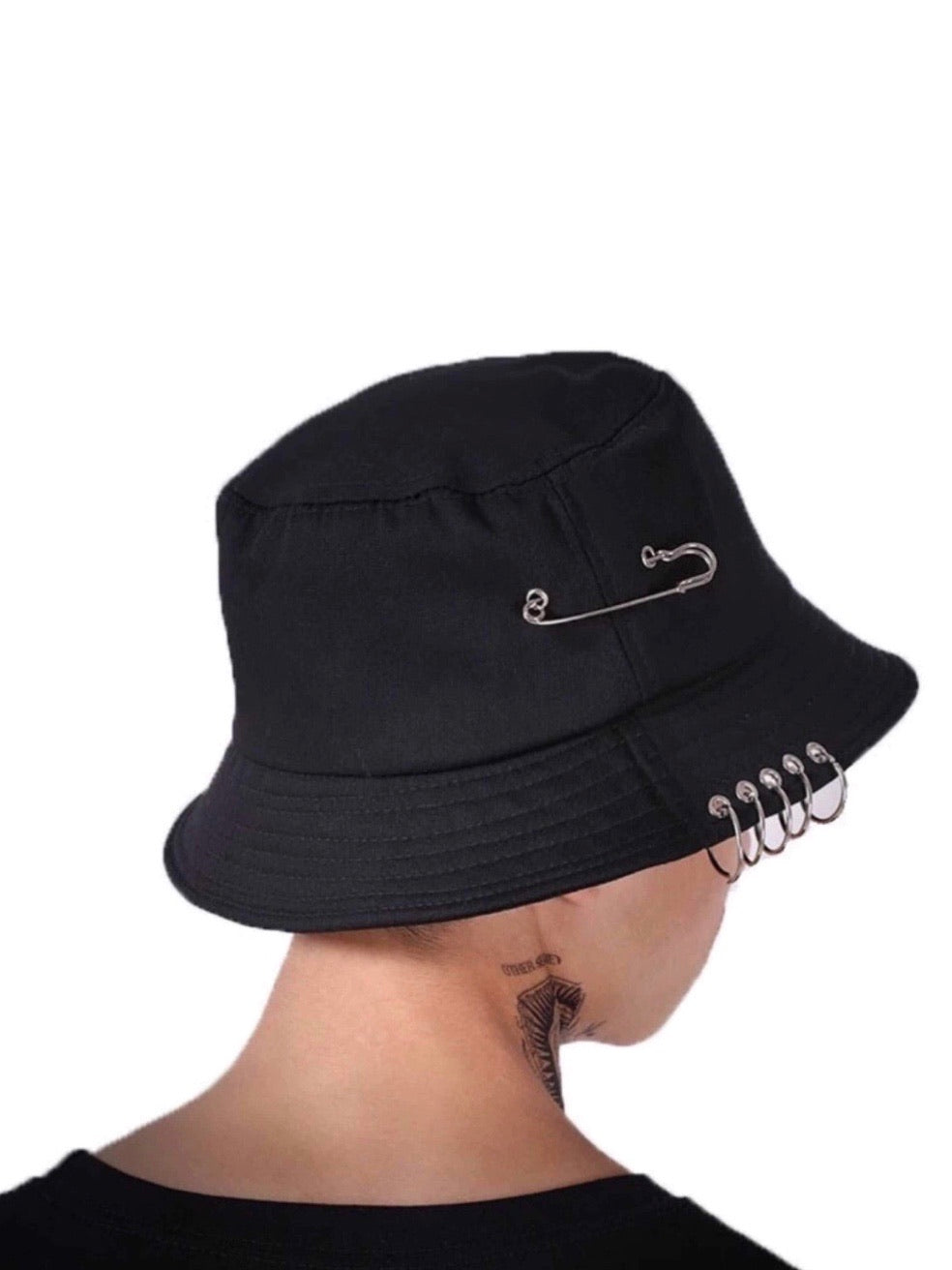 back view of our black bucket hat vh studios with a big pin into it and five rings around it