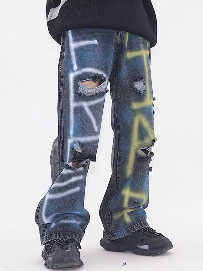 destroyed jeans with graffiti on legs dark blue