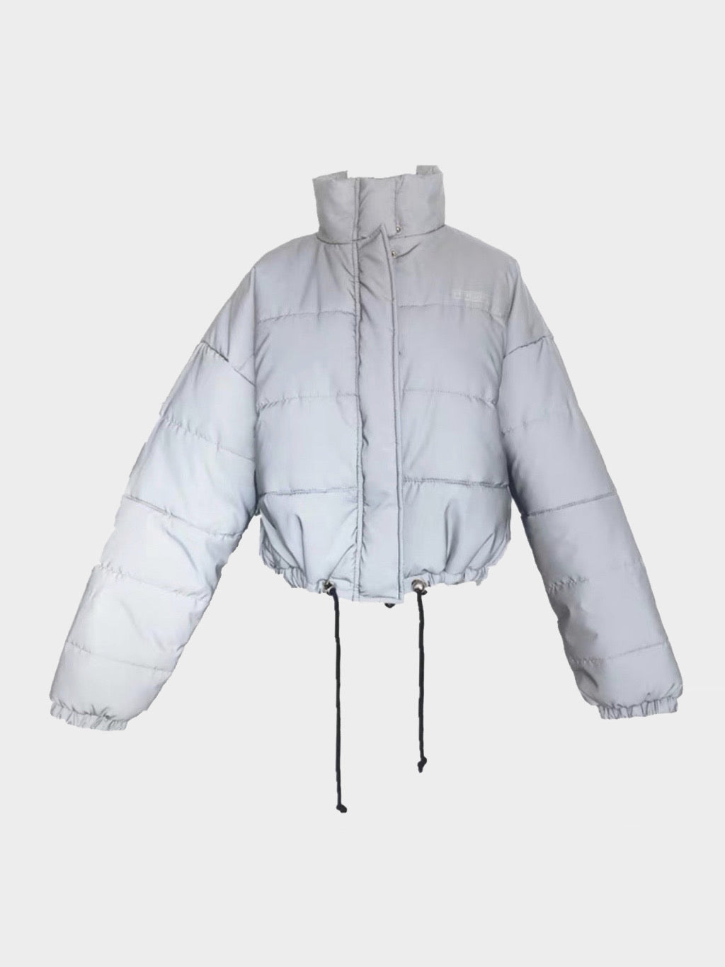 oversize reflective parka adjustable around the waist with a high collar