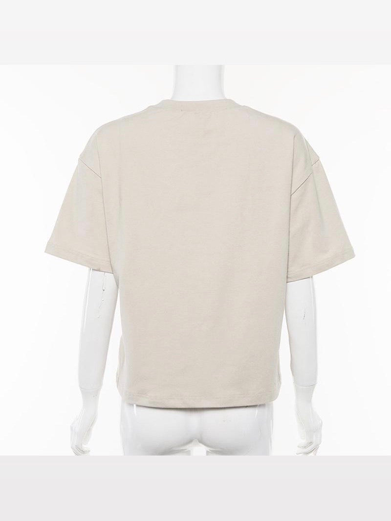 back side of our beige tshirt with three angels printed on the front with the text below fragile in brown