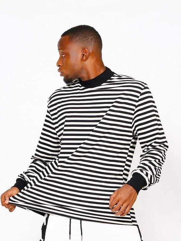 black and white striped sweater with black wrists and collar