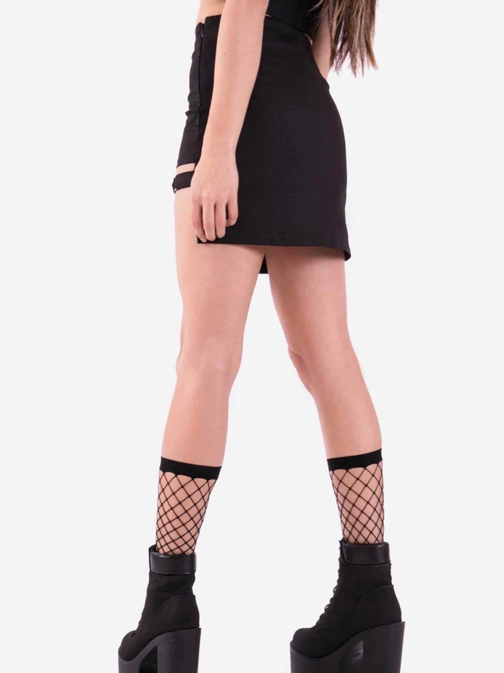 back view of the black high waist skirt opened on the left leg with a strap