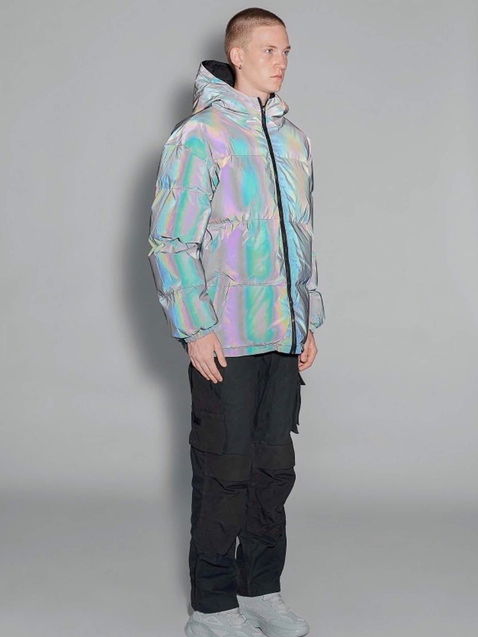 3/4 view of our puffy long reflective jacket with a hood and two front pockets