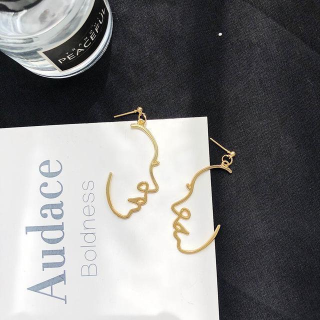 Gold Profile Face earrings